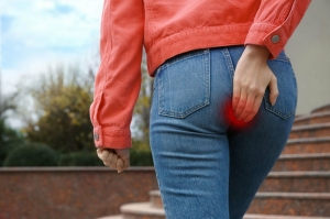 Woman suffering from hemorrhoid